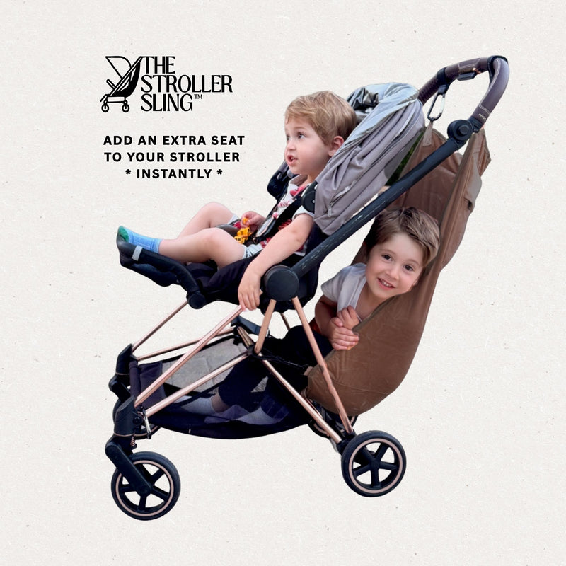 Toddlers using a stroller sling hammock with 'The Stroller Sling' logo above. Text reads 'add an extra seat to your stroller instantly' on a light background. The Stroller Sling hammock is brown and the children are happy. 